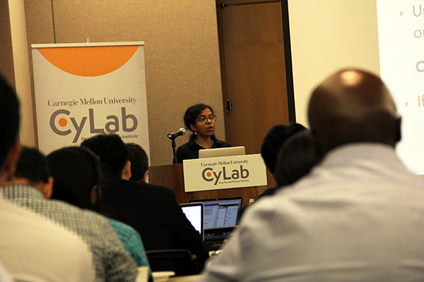 A woman presenting to an audience