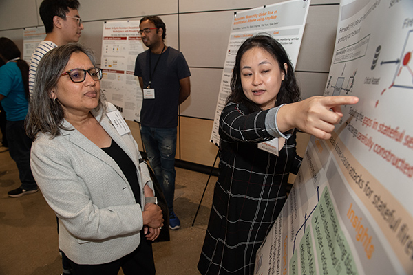 Female student describing her poster